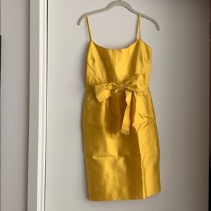 Kate Spade yellow, sleeveless dress with a bow